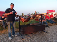 Wayne Cowling with the roasted hog